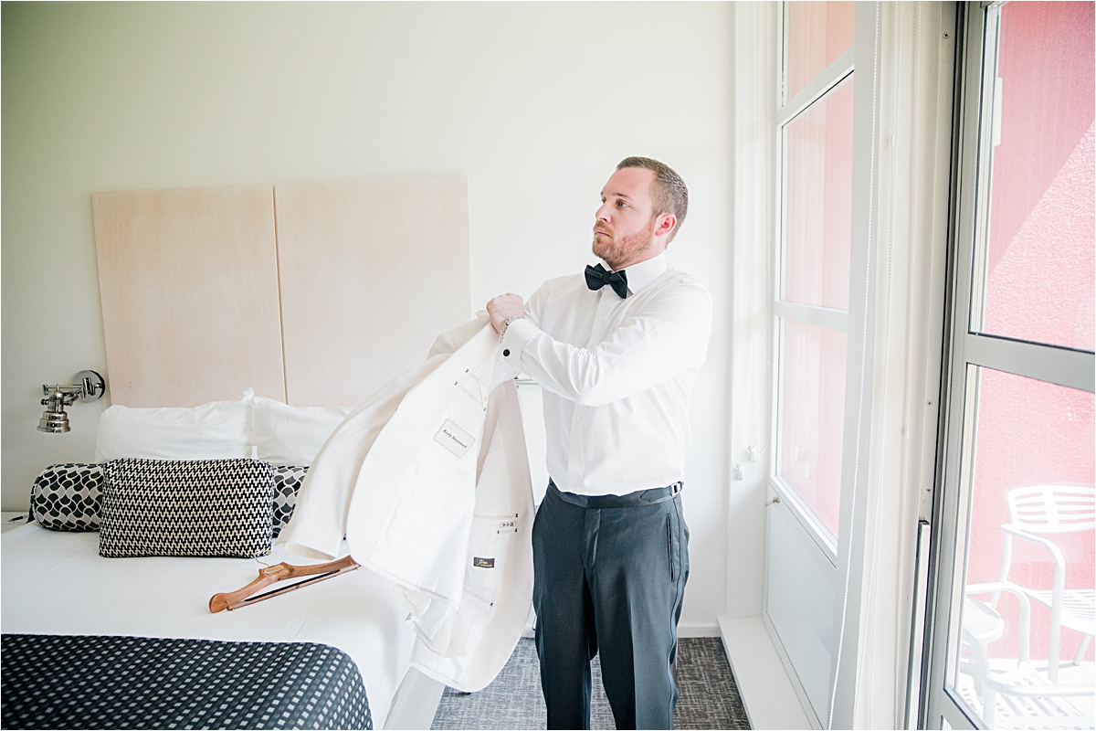 groom in white suit