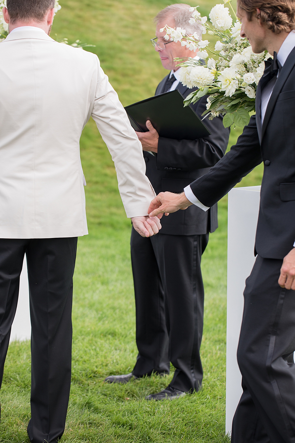 Exchanging of the rings at Ceremony at Aspen Meadows Resort Aspen Colorado Photographer