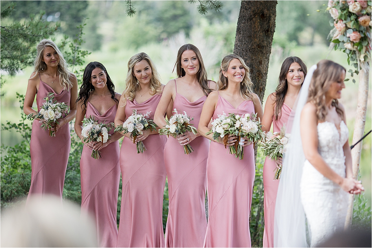 Bridal Party standing at alter with bride in Vail Colorado
