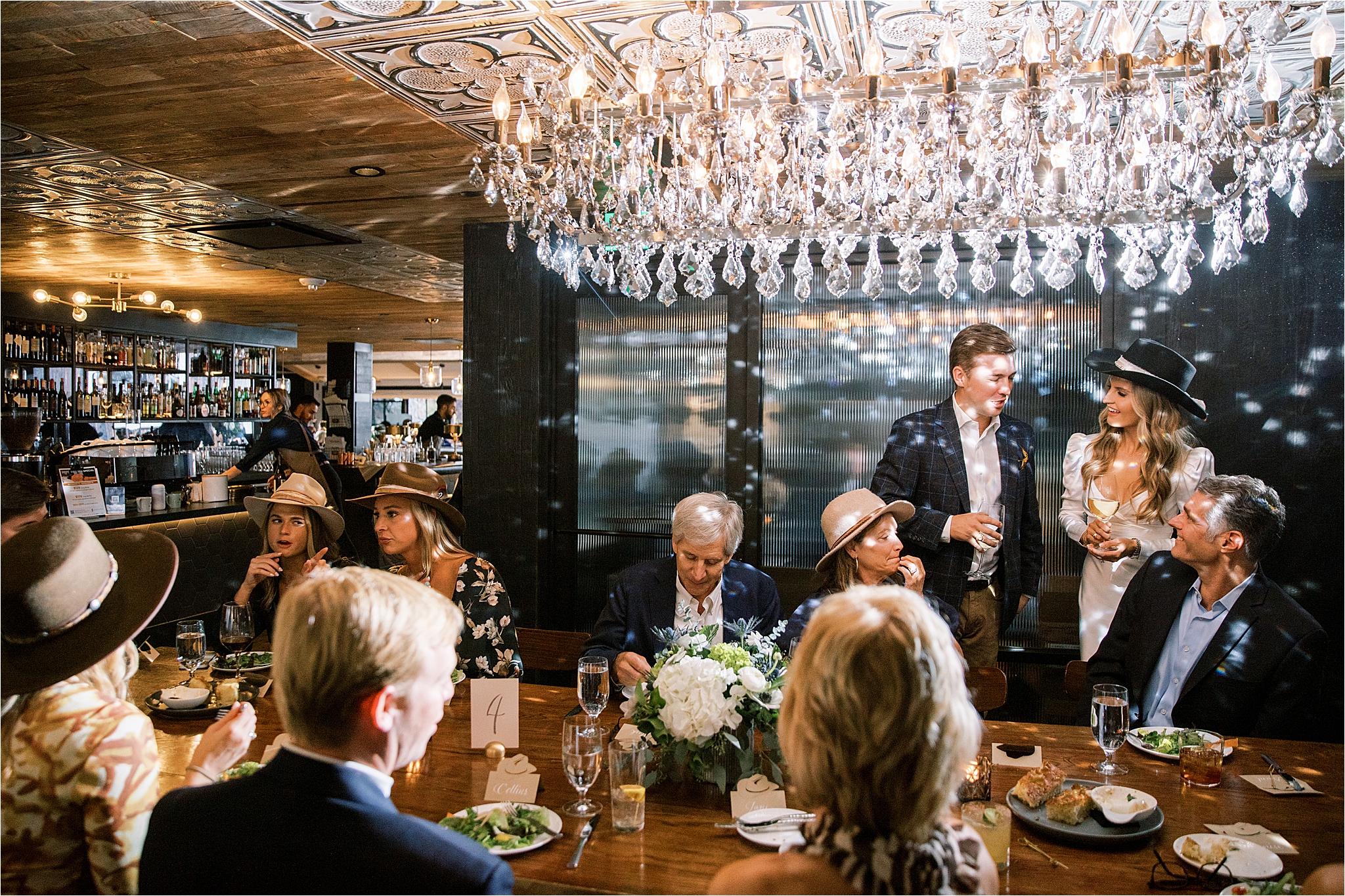 couple greets guests at rehearsal dinner at the slope room in vail colorado